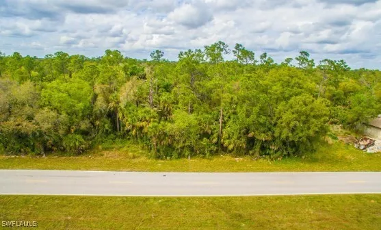 a view of a yard with an ocean view