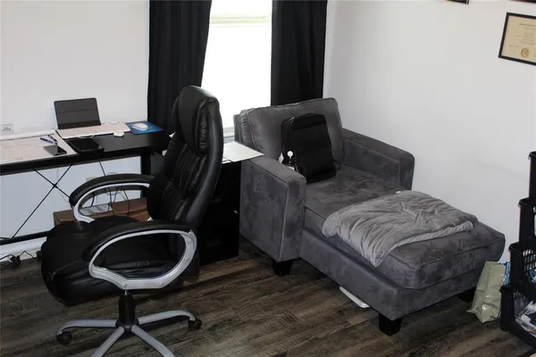 a bedroom with a bed and a desk
