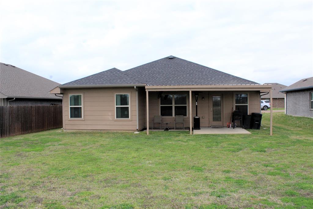 515 Cottage Row Mabank, TX 75147 - Photo 16 of 16 a house view with a garden space
