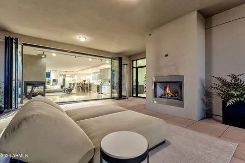 a dining room with furniture and a kitchen view