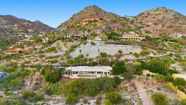 a view of a large building with a mountain in the background