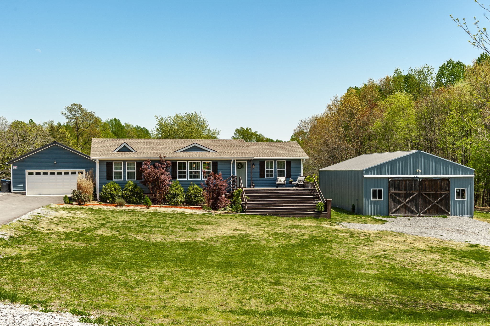 3014 Academy Road Portland, TN 37148 - Photo 1 of 42 a front view of a house with garden