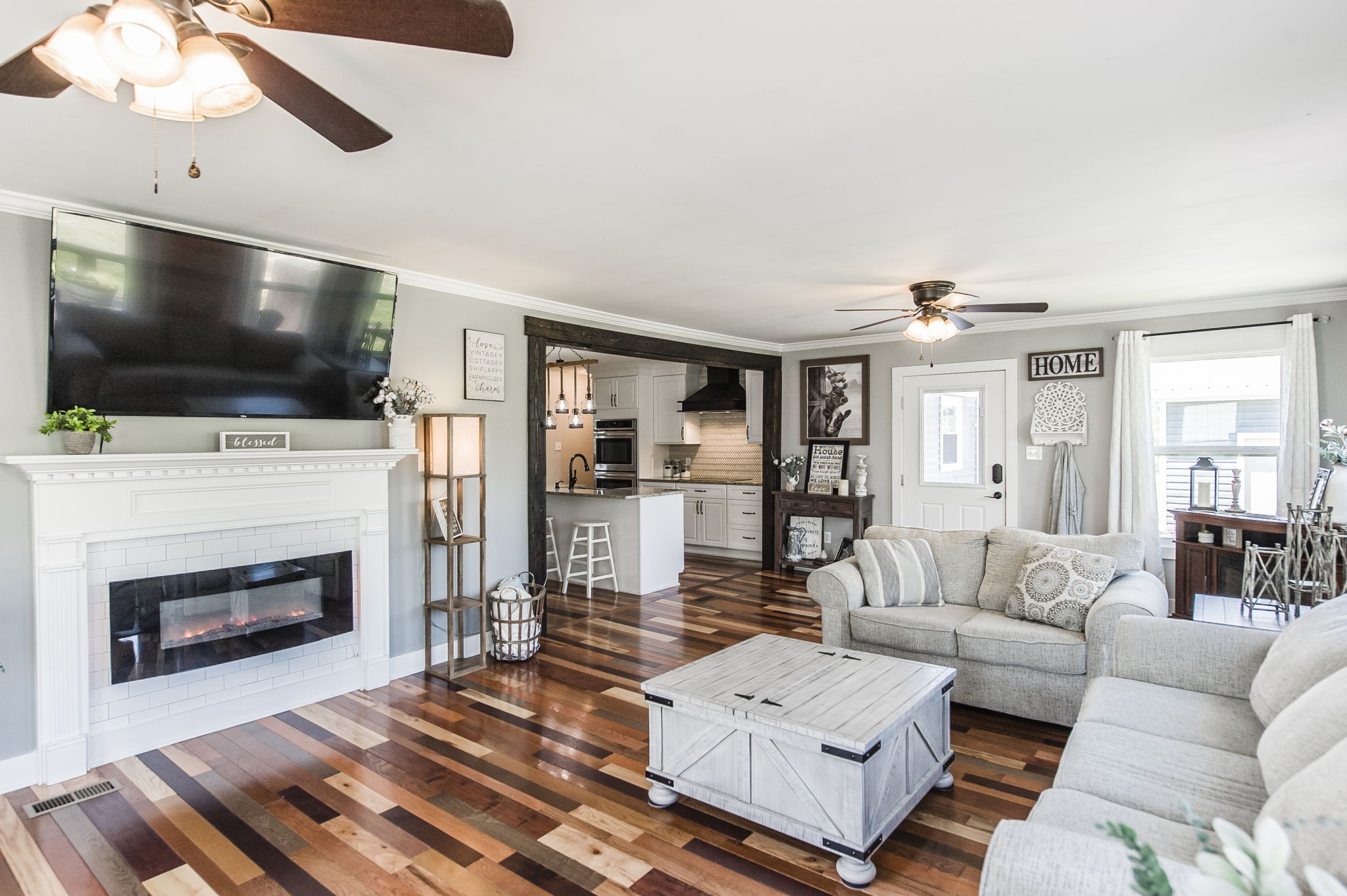 3014 Academy Road Portland, TN 37148 - Photo 15 of 42 a living room with furniture a flat screen tv and a fireplace