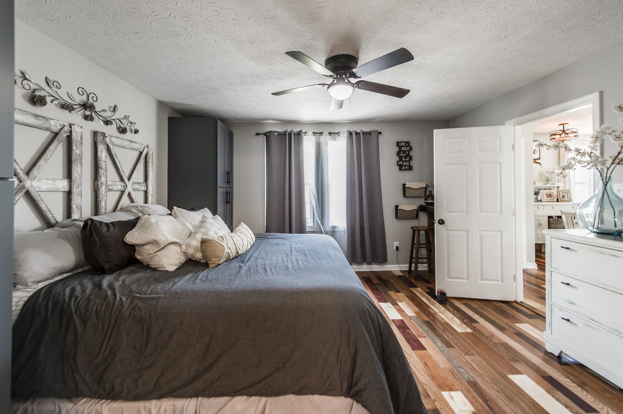 3014 Academy Road Portland, TN 37148 - Photo 16 of 42 a bedroom with a bed and a chandelier