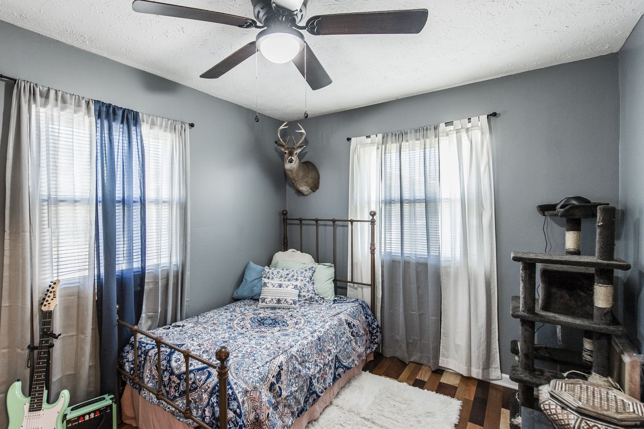 3014 Academy Road Portland, TN 37148 - Photo 19 of 42 a bedroom with a bed and a chandelier