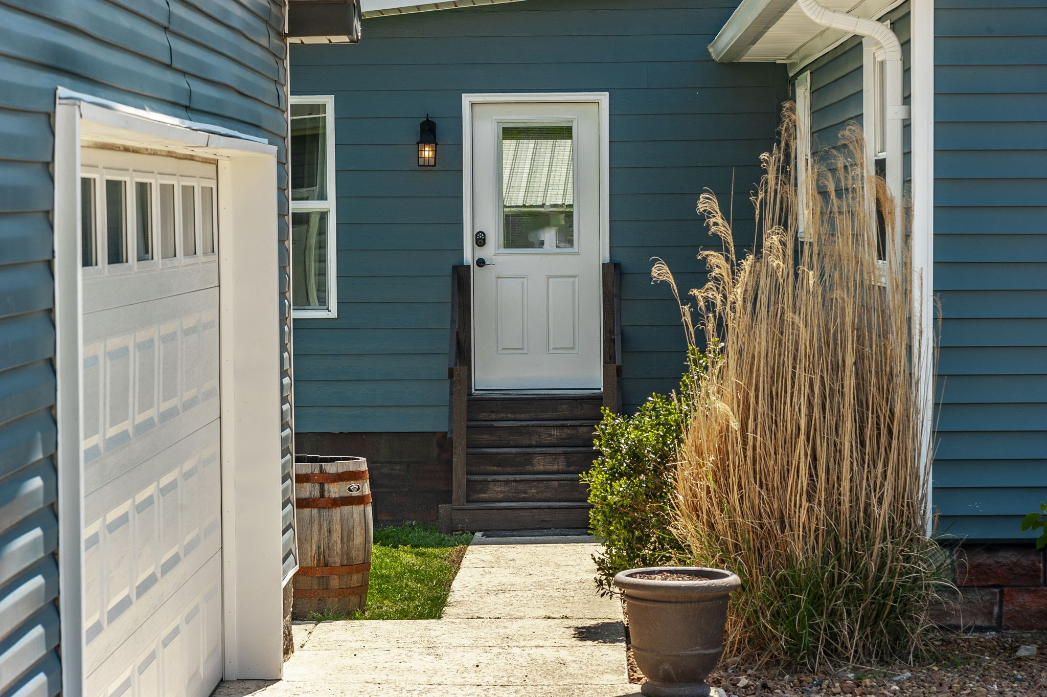 3014 Academy Road Portland, TN 37148 - Photo 25 of 42 a view of a door of the house with potted plants