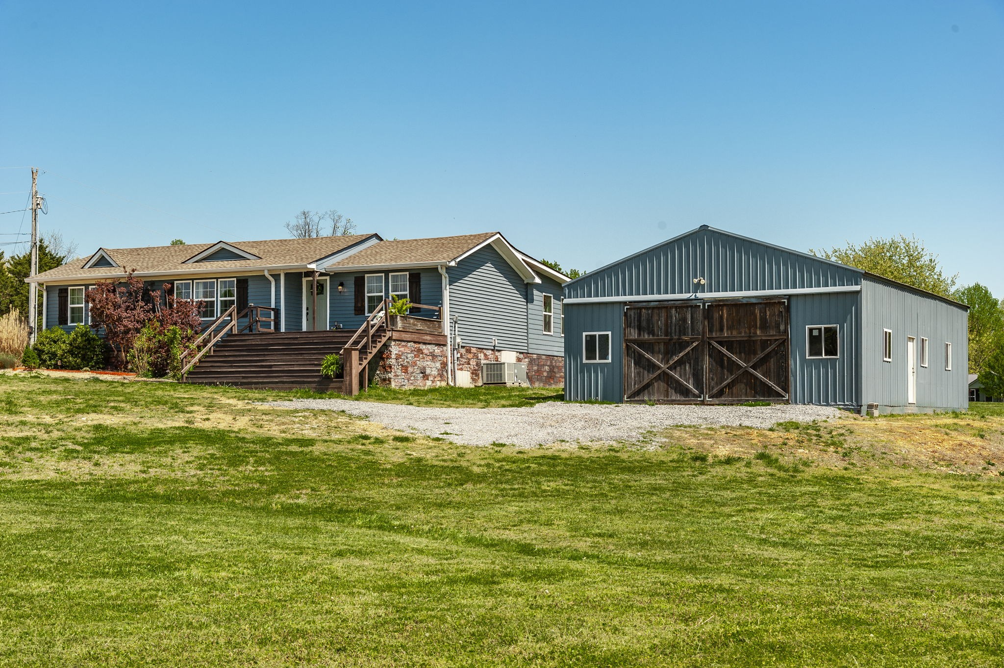 3014 Academy Road Portland, TN 37148 - Photo 3 of 42 a front view of a house with a yard