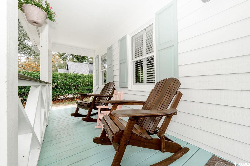 Wooden terrace featuring a porch