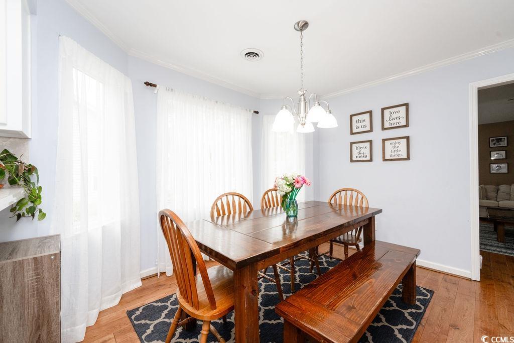71 Great Lakes Road Pawleys Island, SC 29585 - Photo 8 of 32 Dining room featuring plenty of natural light, lig