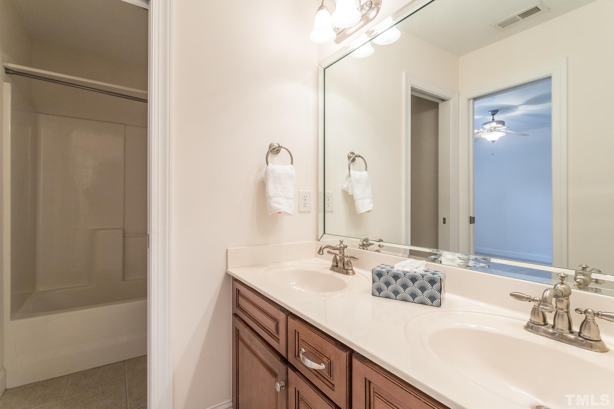 11625 John Allen Road Raleigh, NC 27614 - Photo 2 of 30 a bathroom with a sink and a mirror