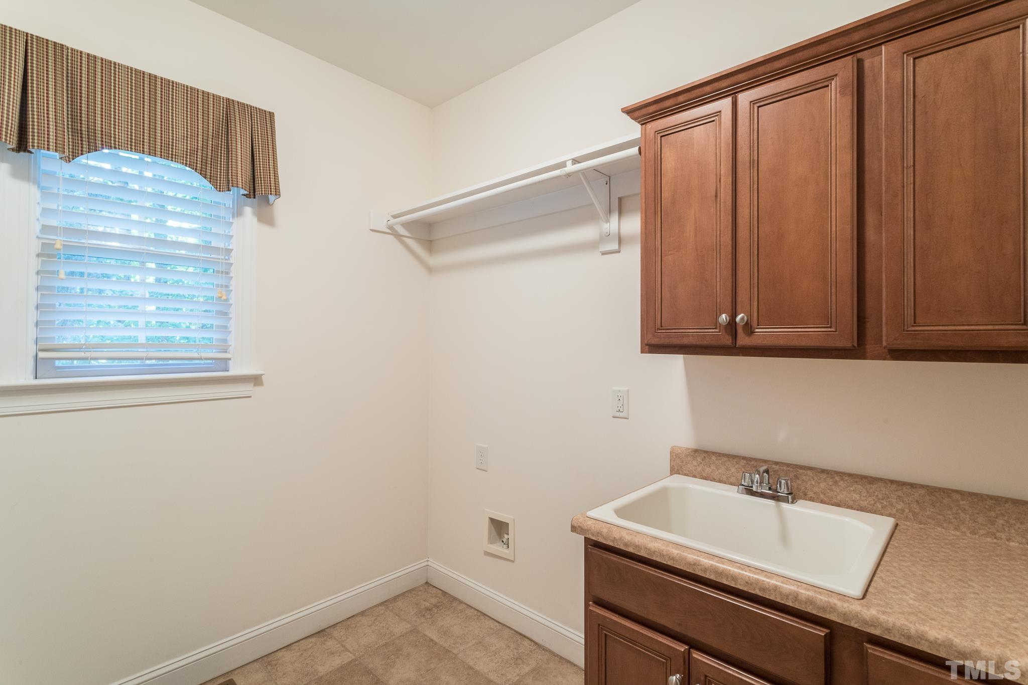 11625 John Allen Road Raleigh, NC 27614 - Photo 12 of 30 a room with a sink and a cabinet