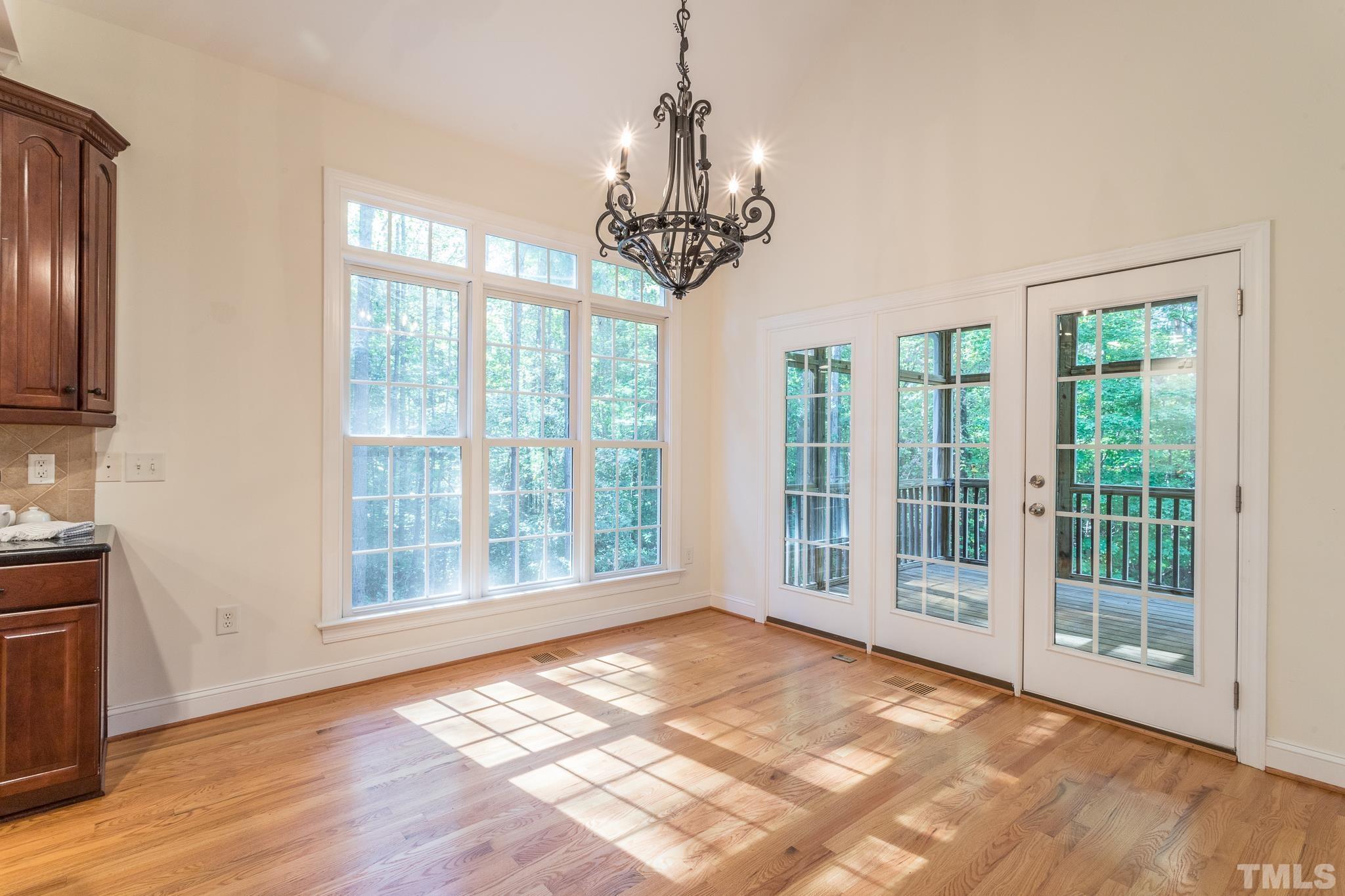 11625 John Allen Road Raleigh, NC 27614 - Photo 17 of 30 a view of an empty room with wooden floor and a window