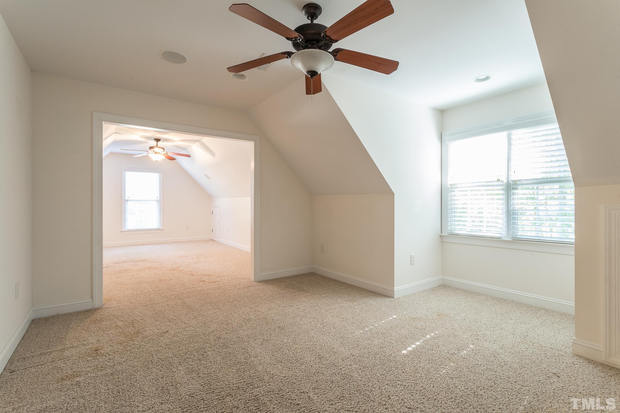 11625 John Allen Road Raleigh, NC 27614 - Photo 3 of 30 a view of a big room with a ceiling fan and windows