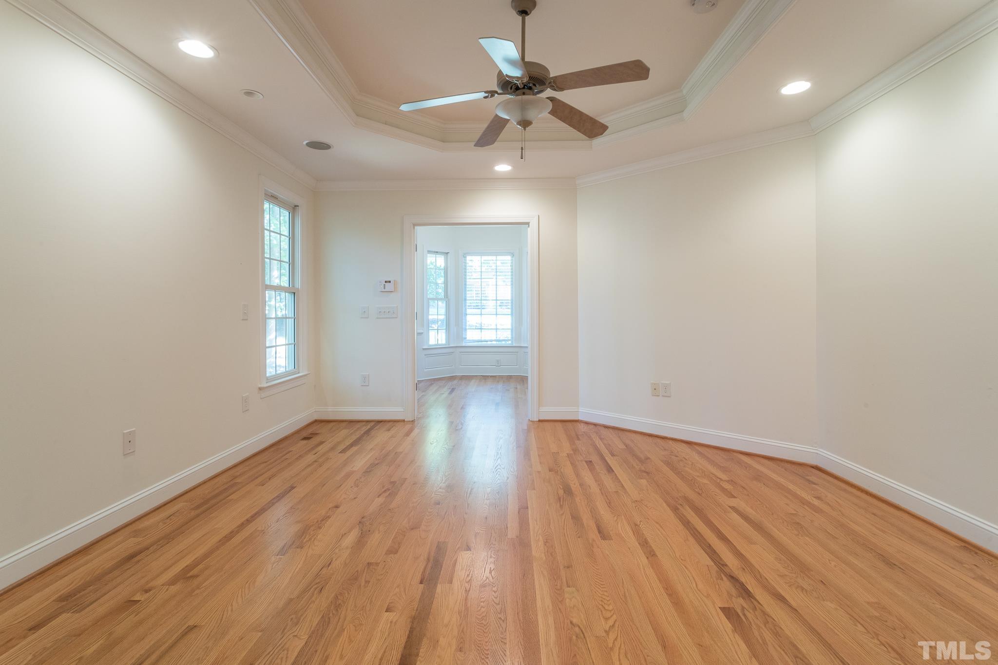 11625 John Allen Road Raleigh, NC 27614 - Photo 23 of 30 an empty room with wooden floor and windows