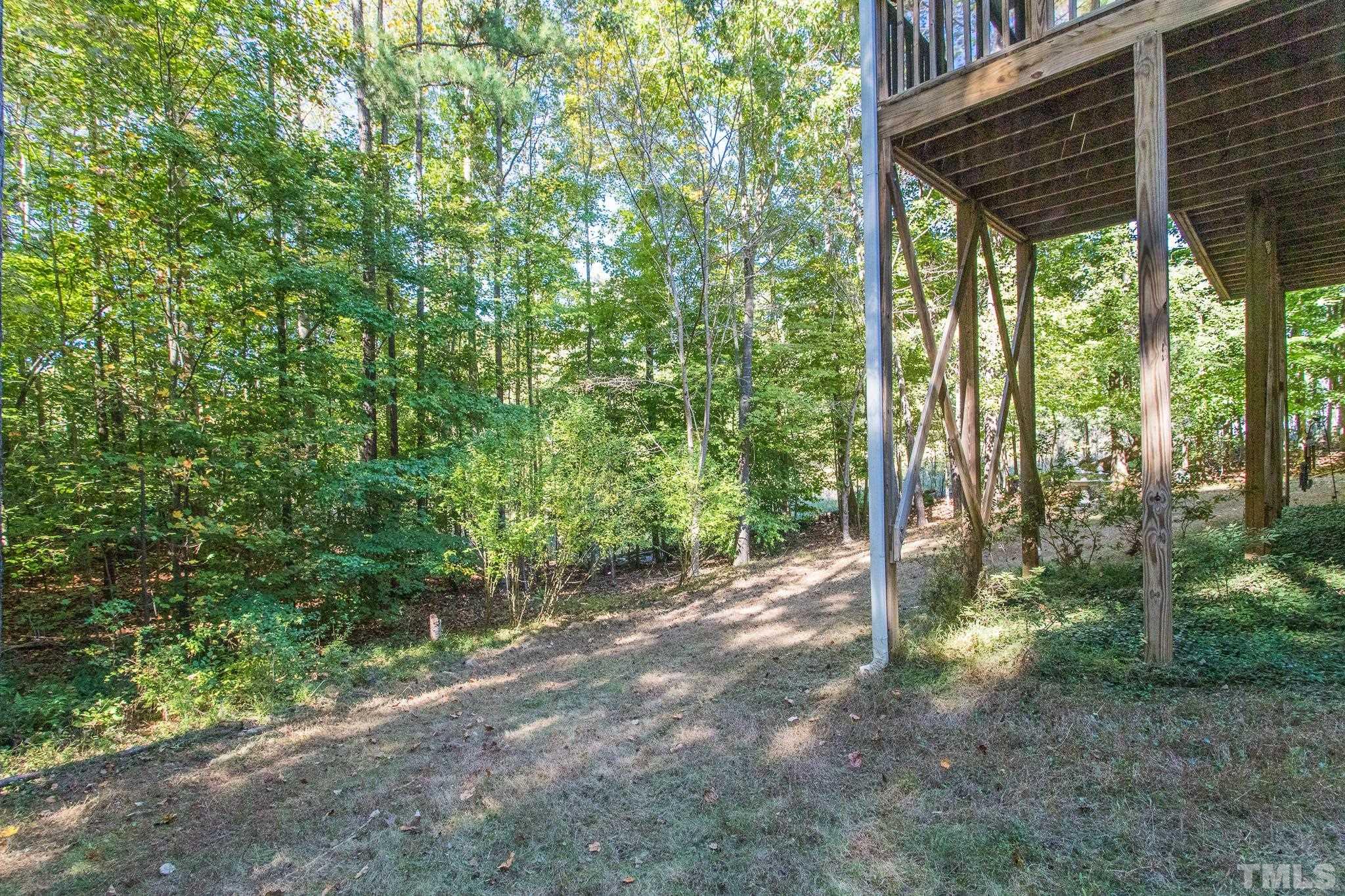 11625 John Allen Road Raleigh, NC 27614 - Photo 28 of 30 a view of a forest with trees in the background