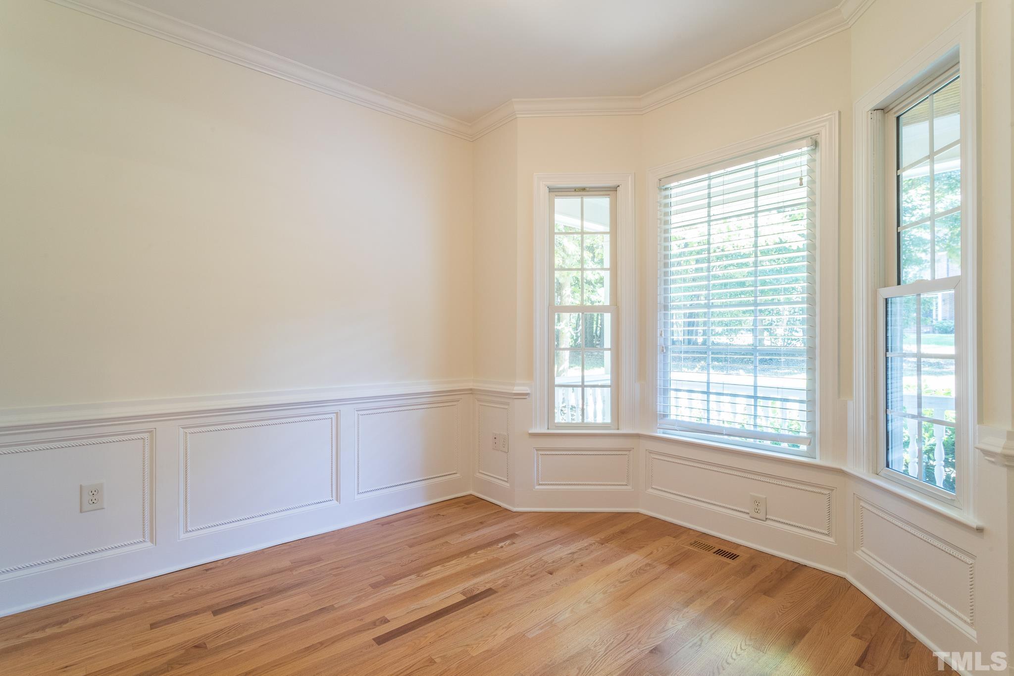 11625 John Allen Road Raleigh, NC 27614 - Photo 10 of 30 a view of an empty room with wooden floor and a window