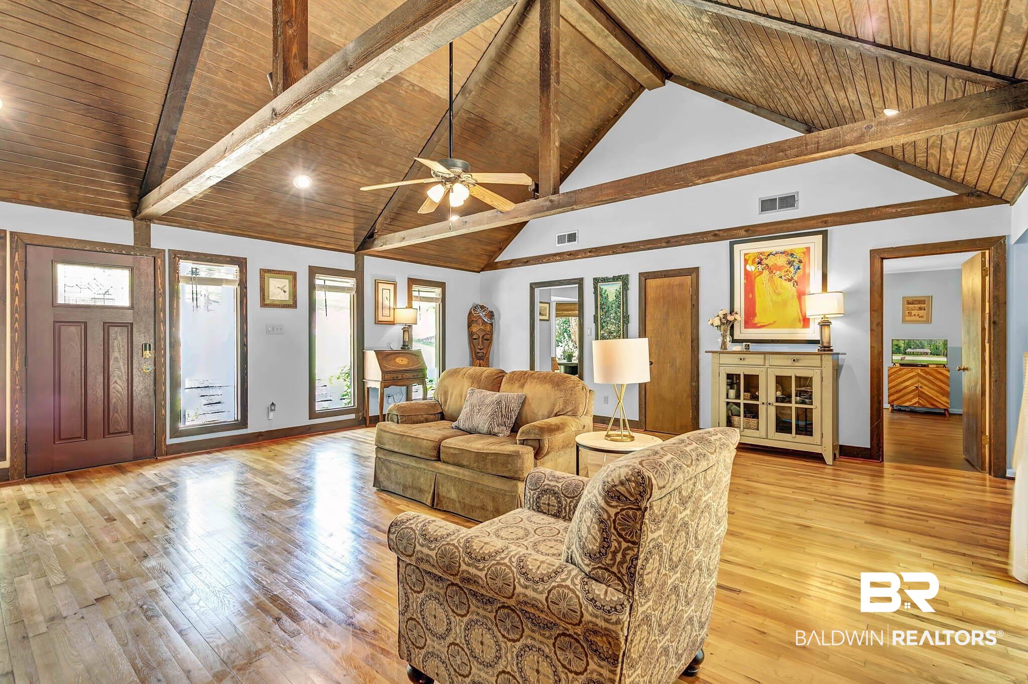 332 Ridgewood Drive Daphne, AL 36526 - Photo 11 of 48 Living room with high vaulted ceiling, light wood finished floors, a wooden ceiling with exposed beams, and a ceiling fan