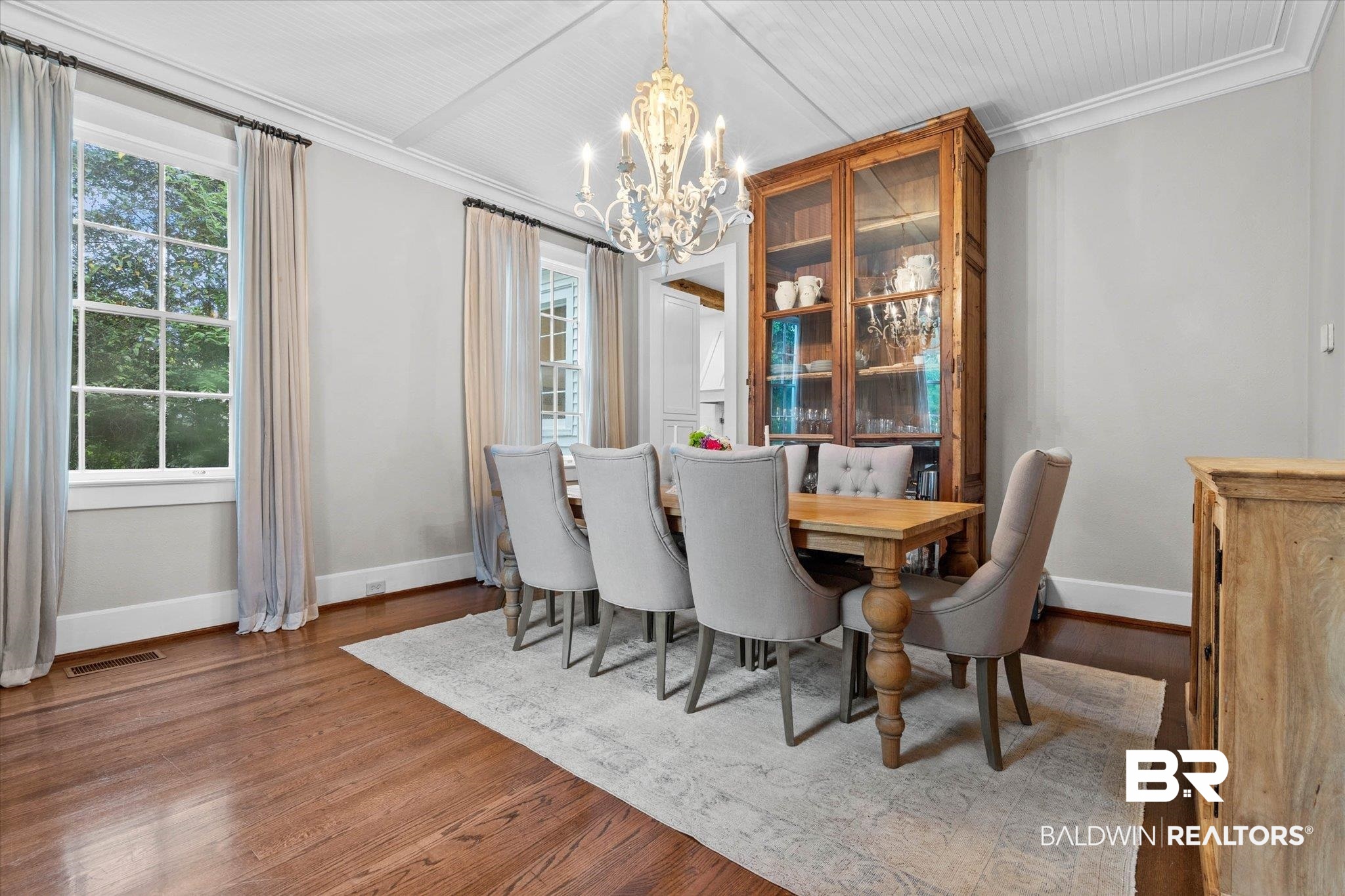 3863 Old Shell Road Mobile, AL 36608 - Photo 17 of 48 Dining area featuring wood-finish flooring, white beadboard ceiling, and crown molding