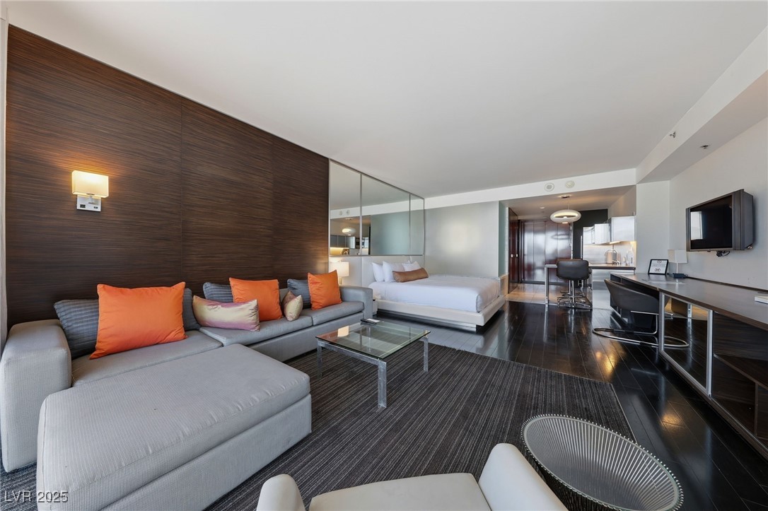 4381 West Flamingo Road, Unit 11308 Las Vegas, NV 89103 - Photo 10 of 26 Living area featuring dark wood-type flooring