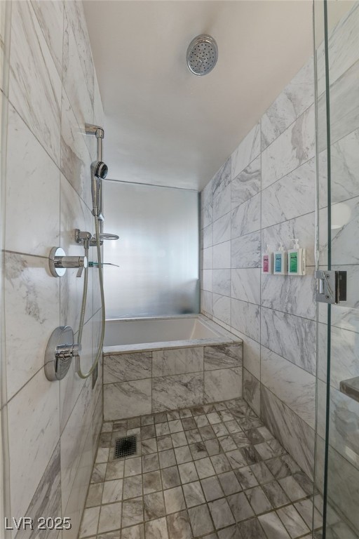 4381 West Flamingo Road, Unit 11308 Las Vegas, NV 89103 - Photo 15 of 26 Bathroom with a marble finish shower and tile walls