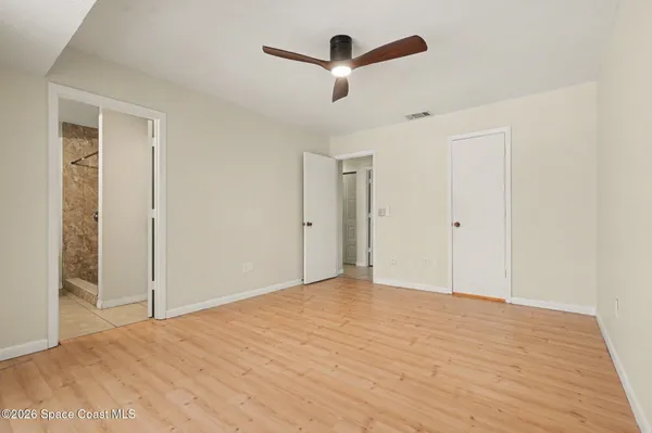 a bathroom with a sink a mirror and shower