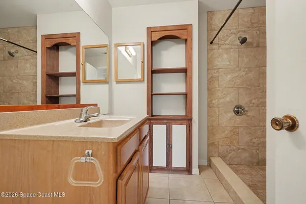 a view of room with window and ceiling fan