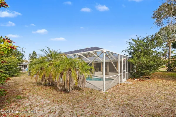 a picture of a room with a cabinet and a rug