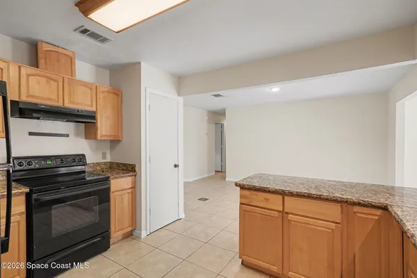 a view of kitchen with furniture and window