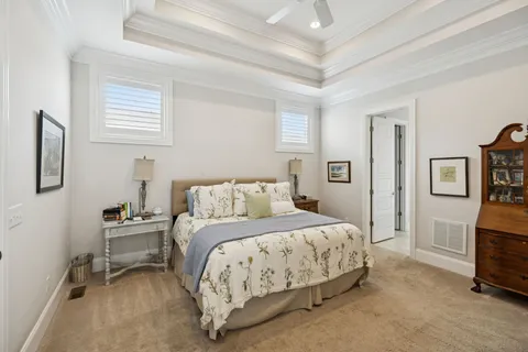 a bedroom with a bed and a mirror