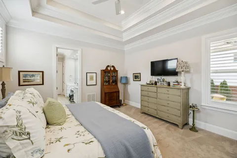 a bedroom with two beds and a window