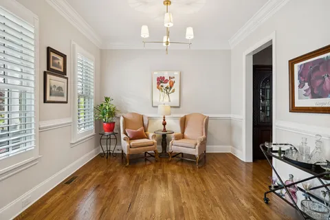 a living room with furniture fireplace and a flat screen tv