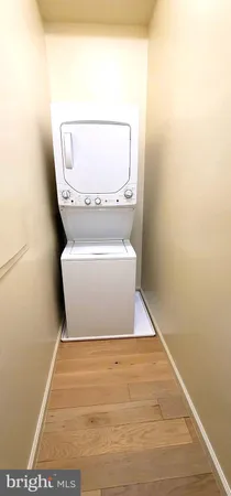 a view of hallway with toilet