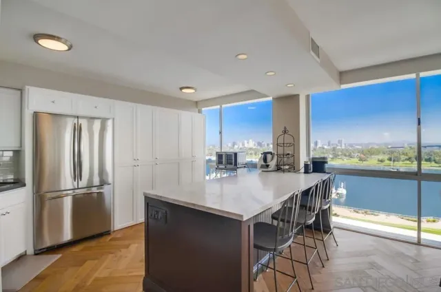 a kitchen with a table and chairs