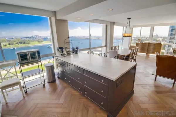 a living room with a large window and a table