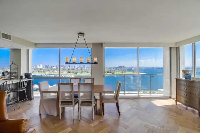 a dining room with furniture window and outside view