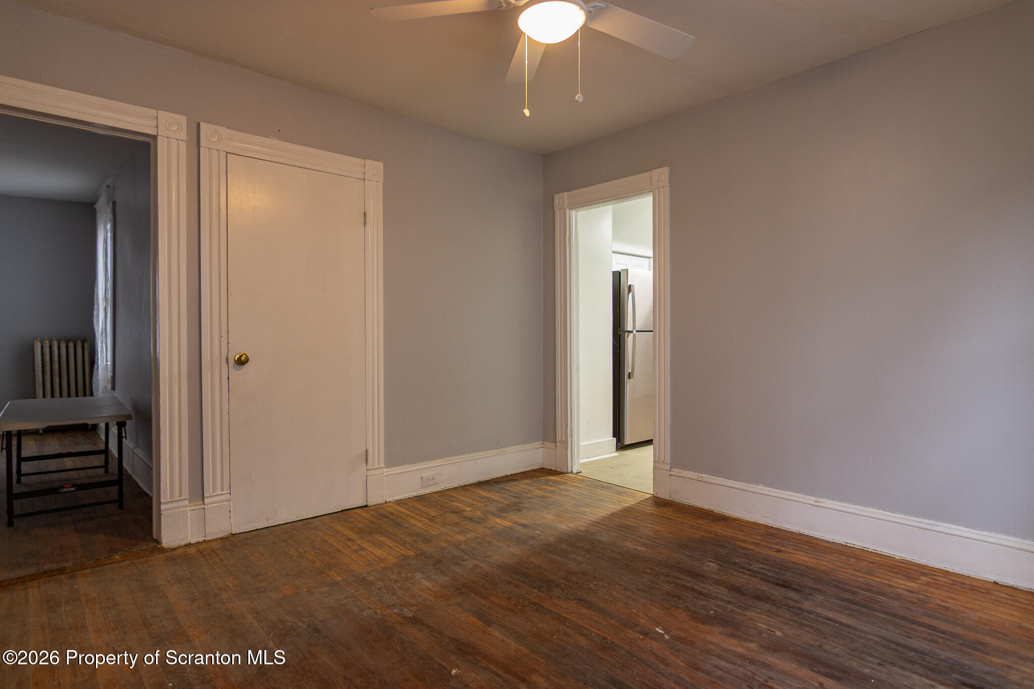 214 William Street Scranton, PA 18508 - Photo 9 of 33 a view of an empty room with wooden floor and a window