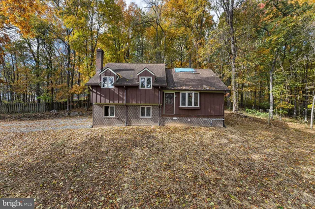 front view of a house with a trees
