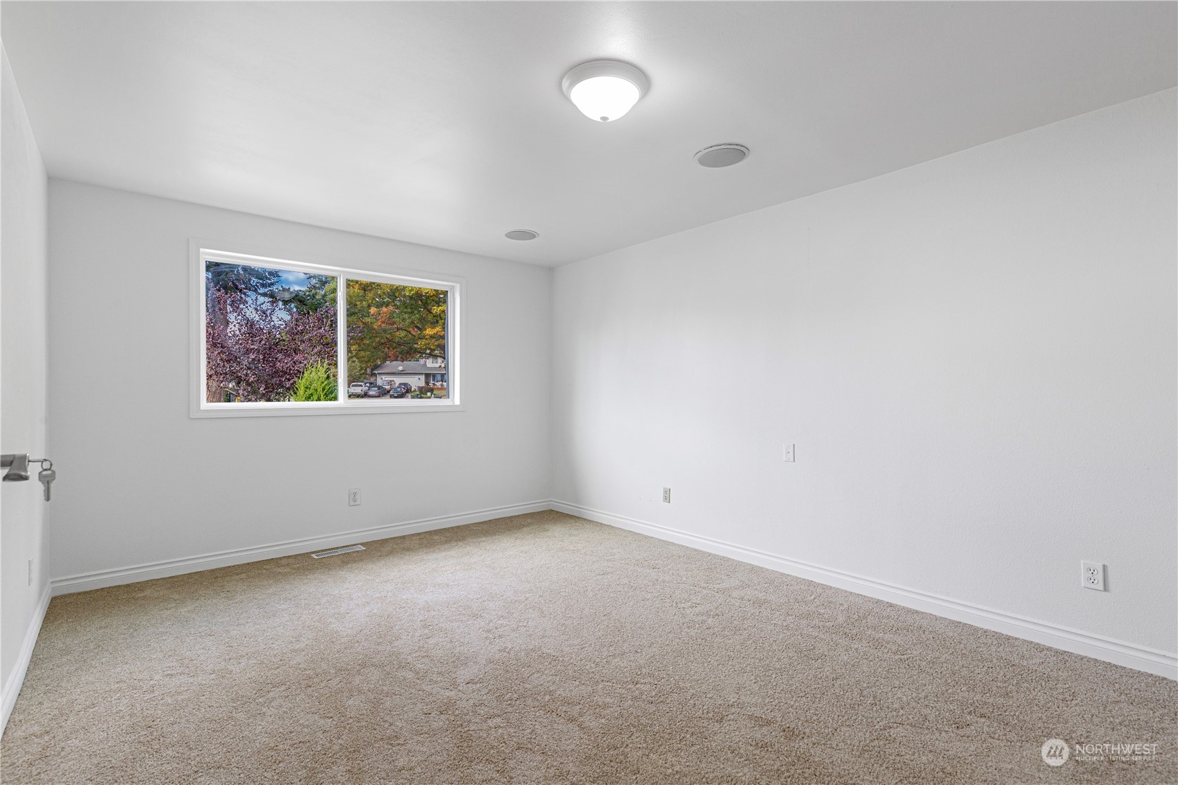 25706 35th Place South Kent, WA 98032 - Photo 20 of 35 an empty room with a window