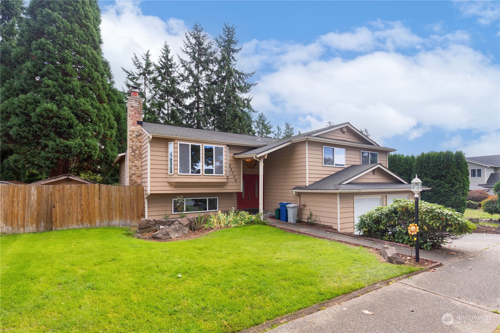 25706 35th Place South Kent, WA 98032 - Photo 35 of 35 a view of a house with a yard and sitting area