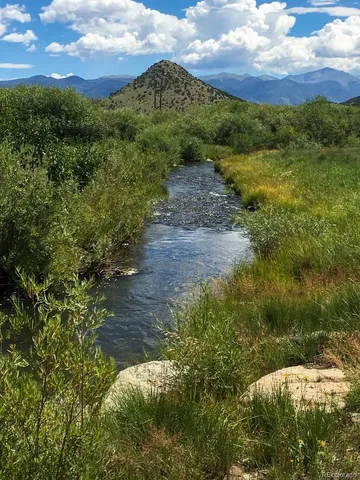 a view of a lake with a building in the background