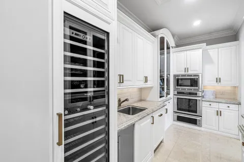 a bathroom with a sink a vanity and a mirror