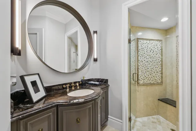 a view of a swimming pool with a lounge chair and palm trees
