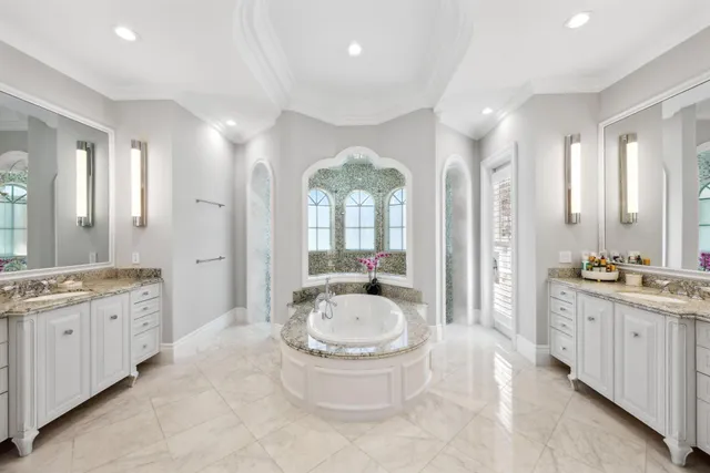 a view of a dining room with furniture and a chandelier