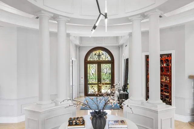 a kitchen with granite countertop a sink stove and cabinets