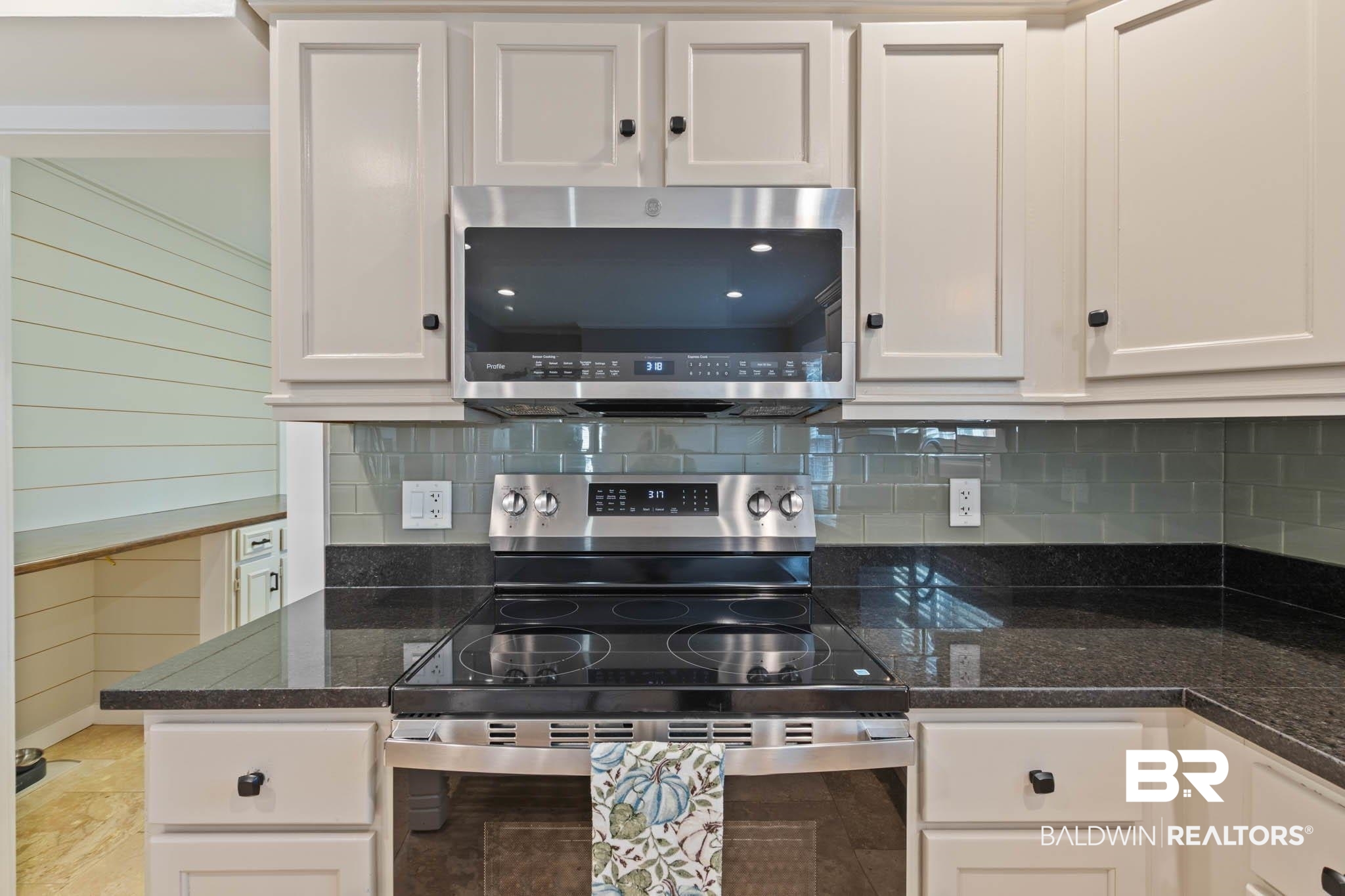 608 Southern Way Daphne, AL 36527 - Photo 10 of 35 Kitchen featuring appliances with stainless steel finishes, decorative backsplash, and white cabinets