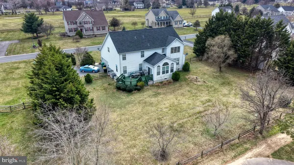 a aerial view of a house with garden and plants