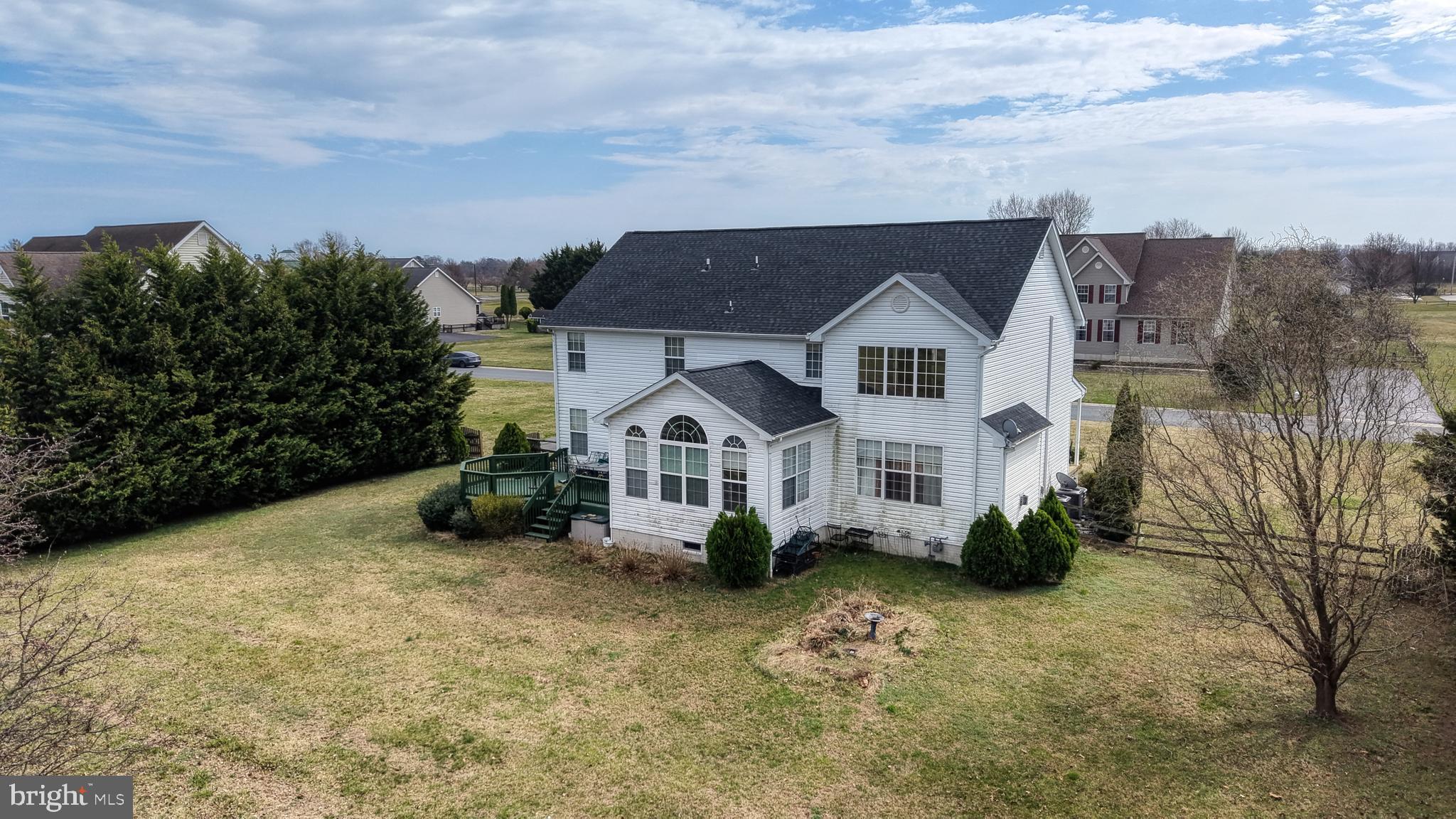 110 Masters Lane Magnolia, DE 19962 - Photo 13 of 65 a front view of a house with a garden and trees