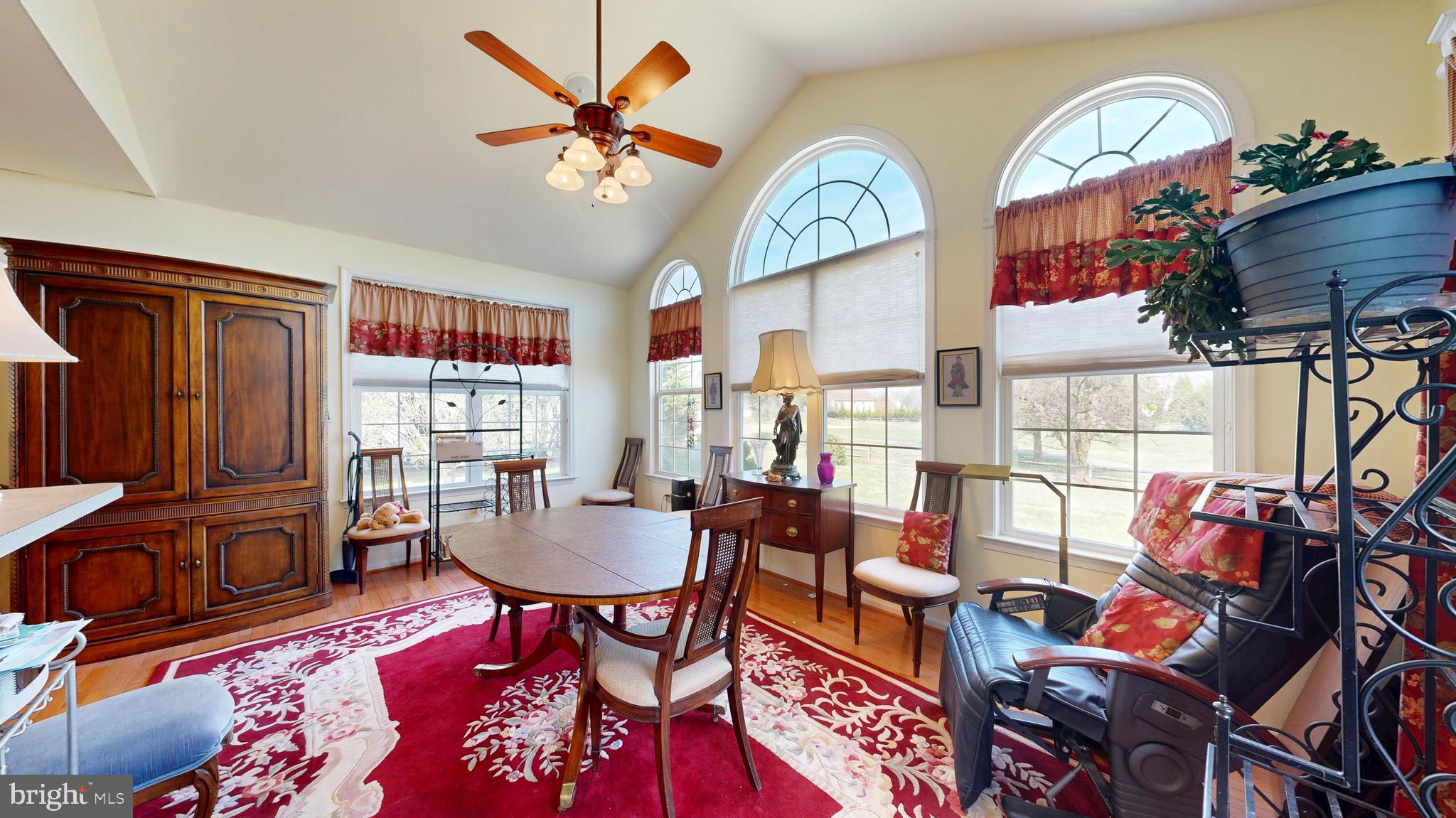 110 Masters Lane Magnolia, DE 19962 - Photo 31 of 65 a living room with furniture a rug and a chandelier