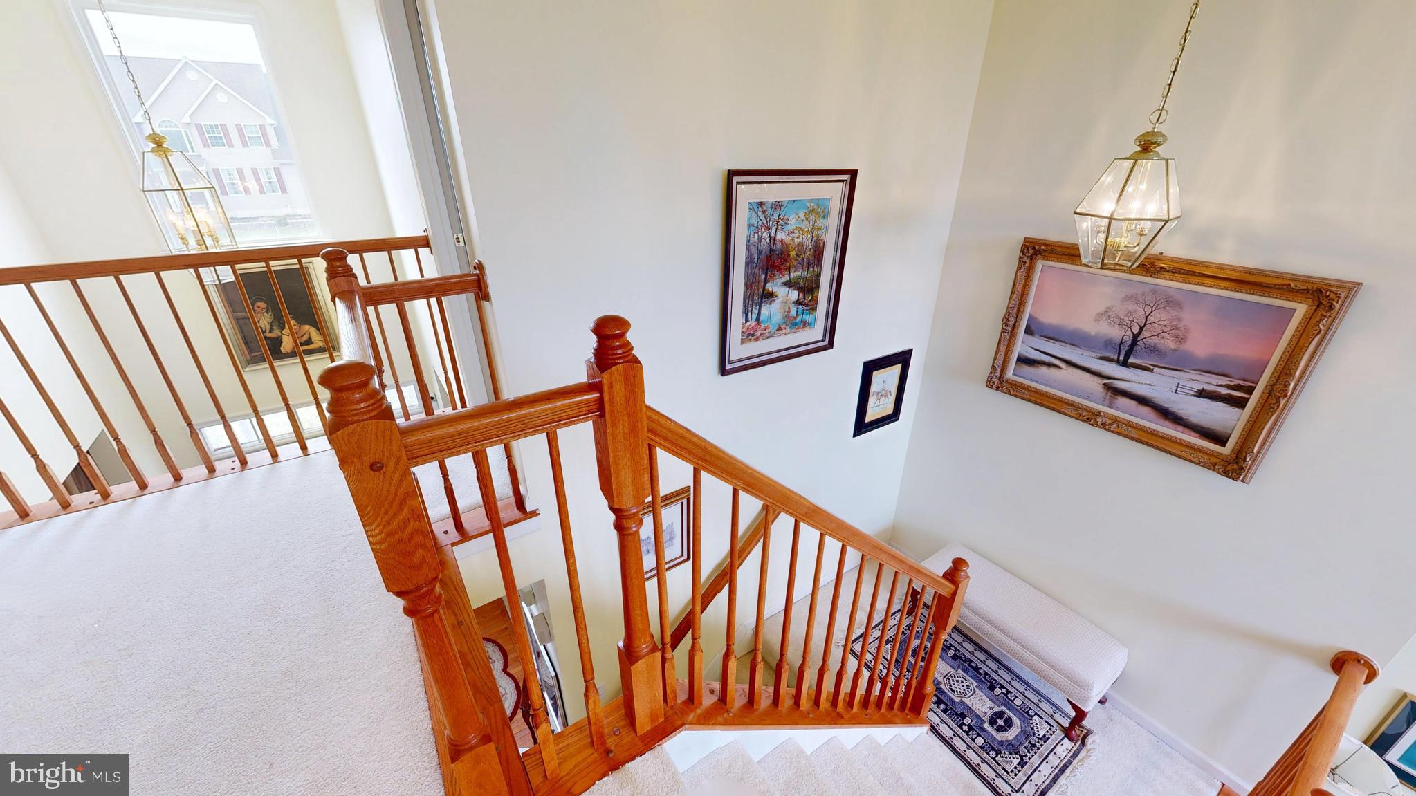 110 Masters Lane Magnolia, DE 19962 - Photo 40 of 65 a view of staircase with lots of frames on wall and a window
