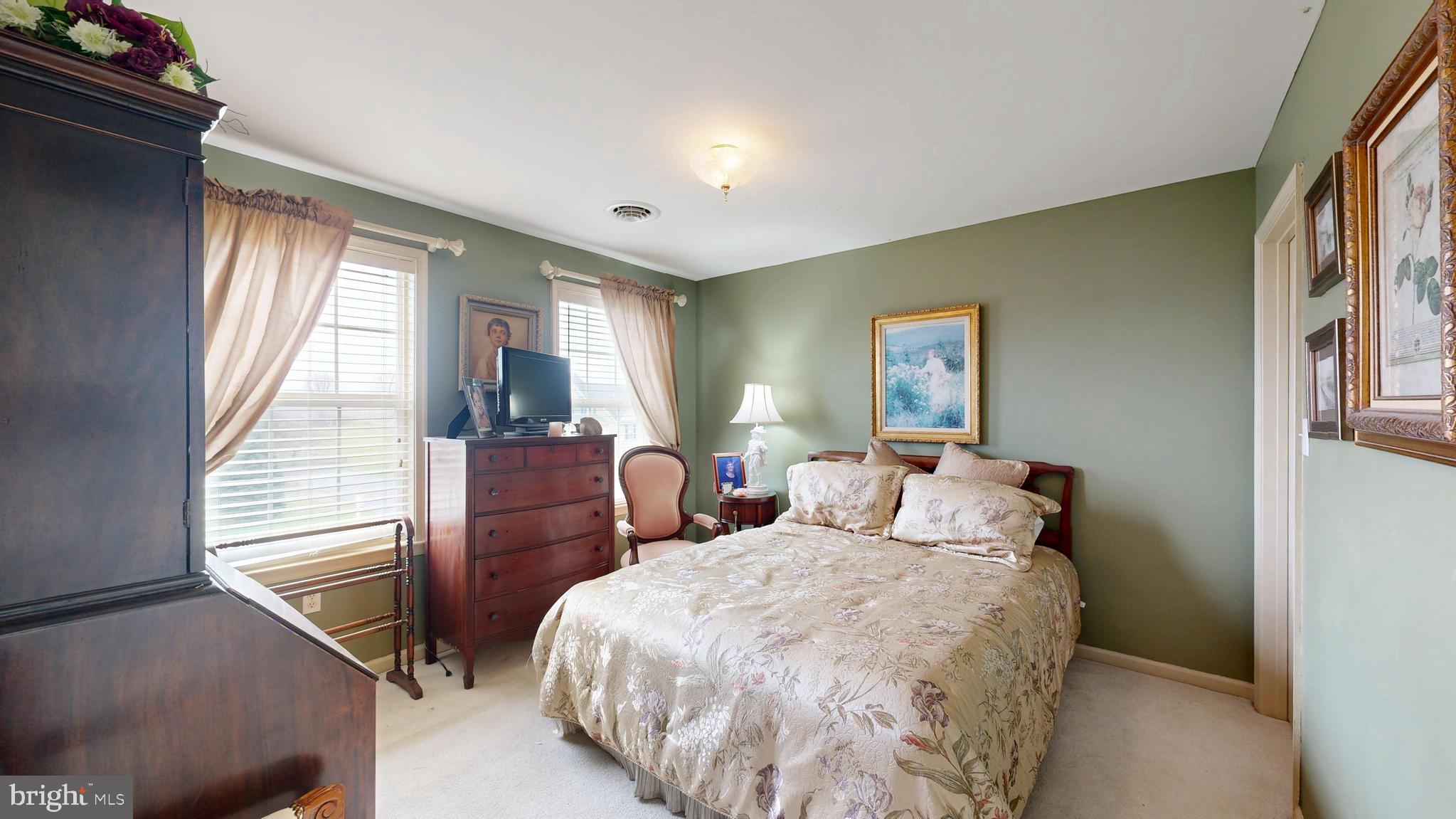 110 Masters Lane Magnolia, DE 19962 - Photo 45 of 65 a bedroom with a bed and wooden floor